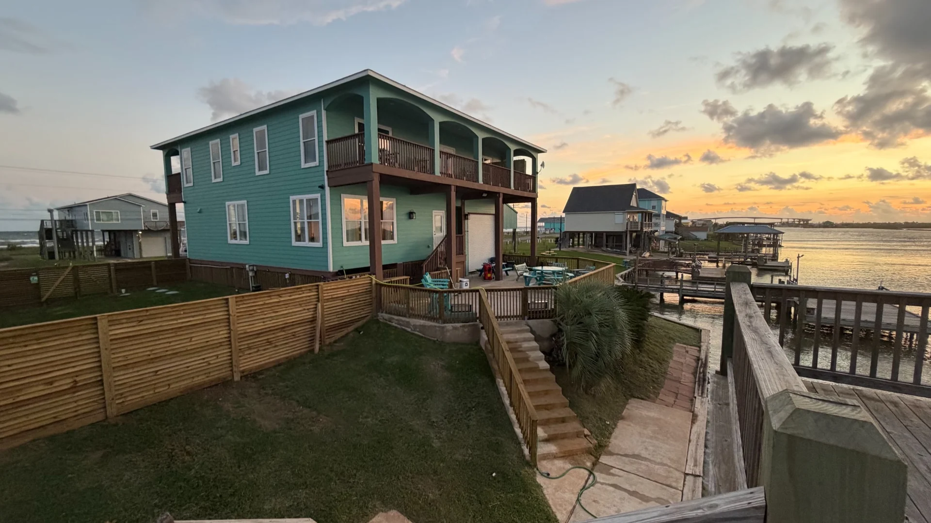 Ace in the Hole Lodge beside the water at sunset