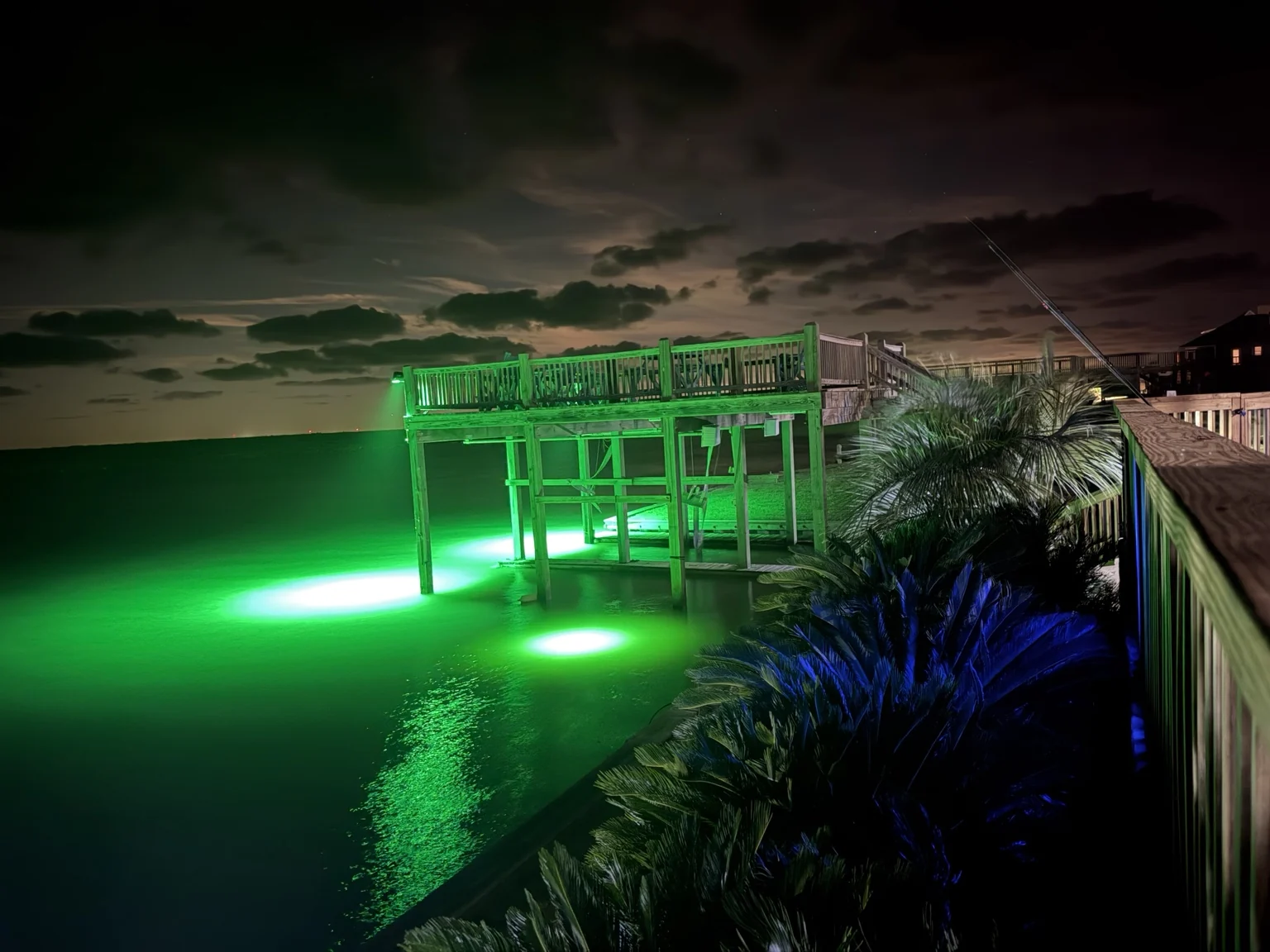 Observation deck and fishing lights glowing over the ICW at night